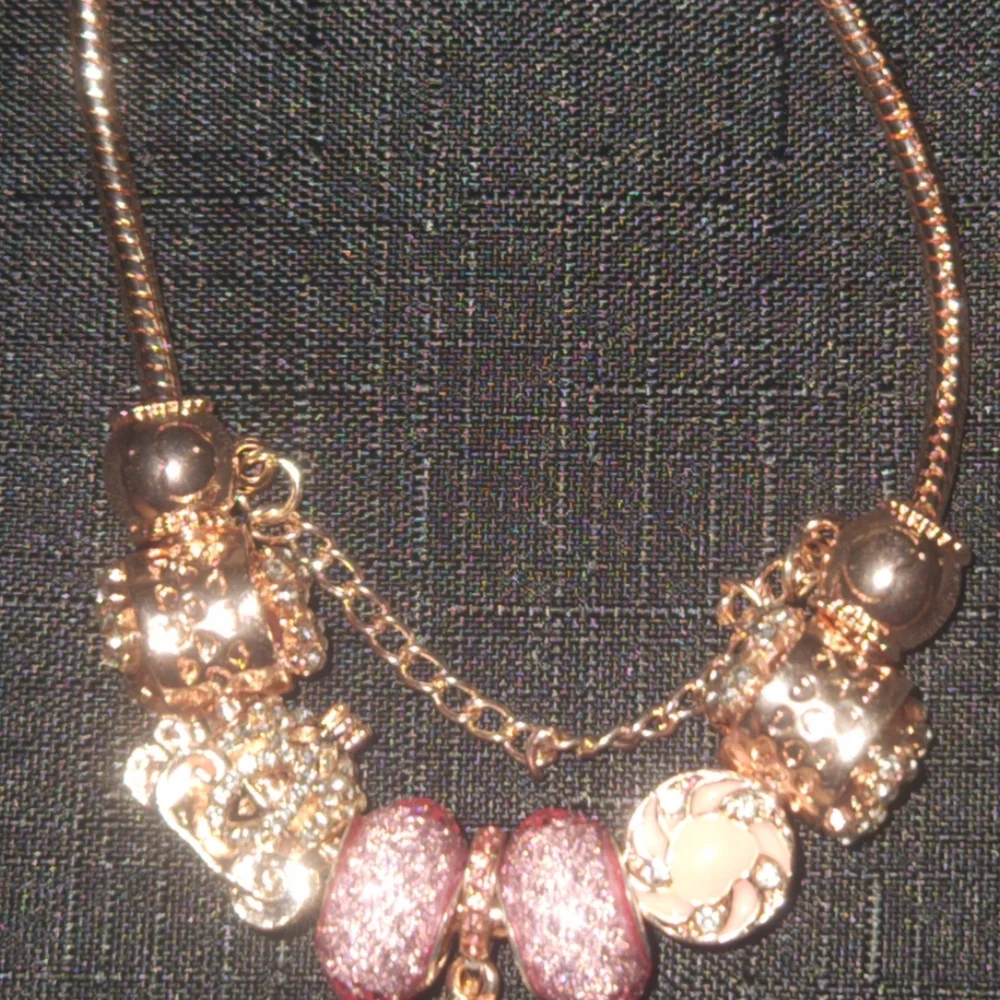 Gold and Pink Charm Bracelet with Ornate Charms. ITEM No. 19-144